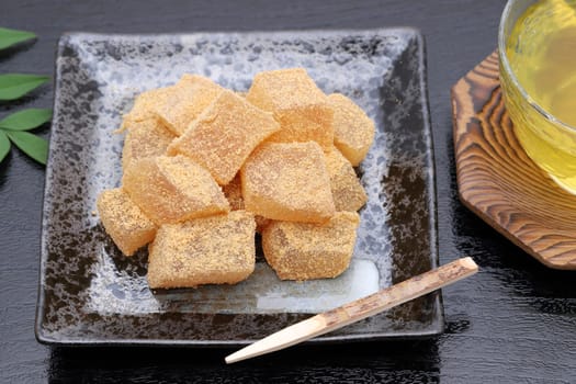 Japanese confectionery, Warabi mochi traditional sweets on black background