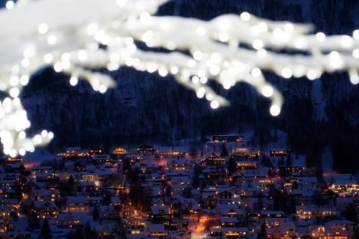Defocused winter tree with lights and decorations in Tromso town, Northern Norway