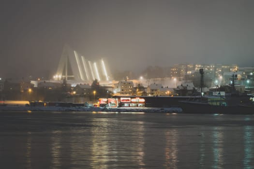 Tromso Harbour and Arctic Cathedral at night, Norway