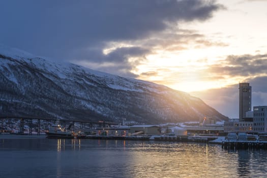Port and harbourin Tromsoysundet strait in Tromso, Northern Norway