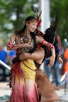 Columbus, Ohio, USA - May 26, 2019: Columbus Asian Festival, Franklin Park, Chinese Dancers wearing traditional clothing performing traditional dances.