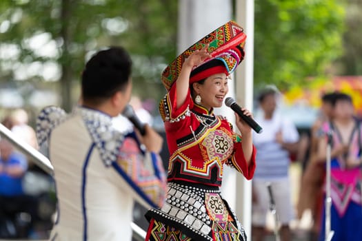 Columbus, Ohio, USA - May 26, 2019: Columbus Asian Festival, Franklin Park, Chinese Dancers wearing traditional clothing performing traditional songs at the Festival