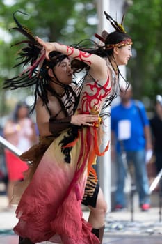 Columbus, Ohio, USA - May 26, 2019: Columbus Asian Festival, Franklin Park, Chinese Dancers wearing traditional clothing performing traditional dances.