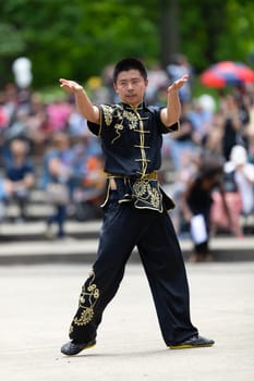 Columbus, Ohio, USA - May 26, 2019: Columbus Asian Festival, Franklin Park, Chinese man wearing traditional clothing displaying his martial arts skill