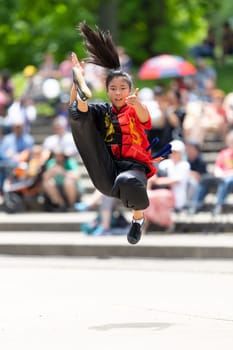 Columbus, Ohio, USA - May 26, 2019: Columbus Asian Festival, Franklin Park, Chinese woman wearing traditional chinese traditional clothing, performing a display of chinese martial arts