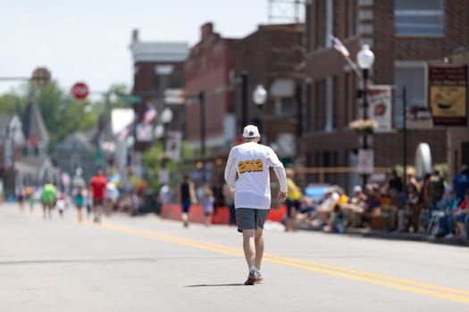 Buckhannon, West Virginia, USA - May 18, 2019: Strawberry Festival, Senior, walking down the street to the finish line during a competition prior to the parade