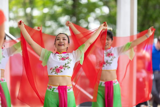 Columbus, Ohio, USA - May 26, 2019: Columbus Asian Festival, Franklin Park, Chinese Dancers wearing traditional chinese clothing, performing a display of chinese traditional dancing