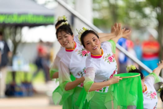 Columbus, Ohio, USA - May 26, 2019: Columbus Asian Festival, Franklin Park, Chinese Dancers wearing traditional chinese clothing, performing a display of chinese traditional dancing