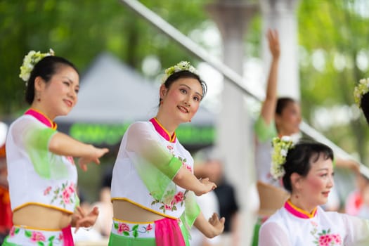 Columbus, Ohio, USA - May 26, 2019: Columbus Asian Festival, Franklin Park, Chinese Dancers wearing traditional chinese clothing, performing a display of chinese traditional dancing