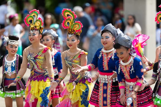 Columbus, Ohio, USA - May 26, 2019: Columbus Asian Festival, members of the spectators wearing traditional clothing, dancing to Bhangra traditional dance in the amphitheater at Franklin Park