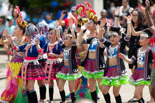 Columbus, Ohio, USA - May 26, 2019: Columbus Asian Festival, members of the spectators wearing traditional clothing, dancing to Bhangra traditional dance in the amphitheater at Franklin Park