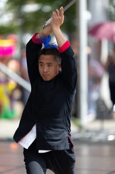 Columbus, Ohio, USA - May 26, 2019: Columbus Asian Festival, Chinese Men and women performing a display of shaolin martial arts in the amphitheater at Franklin Park