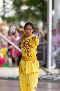 Columbus, Ohio, USA - May 26, 2019: Columbus Asian Festival, Chinese Men and women performing a display of shaolin martial arts in the amphitheater at Franklin Park