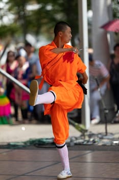 Columbus, Ohio, USA - May 26, 2019: Columbus Asian Festival, Chinese Men and women performing a display of shaolin martial arts in the amphitheater at Franklin Park