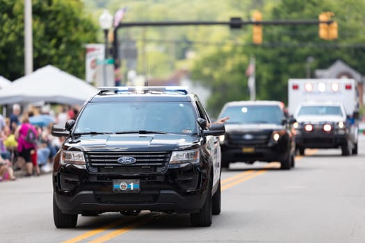 Buckhannon, West Virginia, USA - May 18, 2019: Strawberry Festival, Ford, Explorer, Police patrol going down main street during the parade