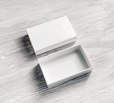 Blank paper box on light wooden background. White box mockup. Branding mockup.