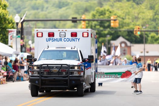 Buckhannon, West Virginia, USA - May 18, 2019: Strawberry Festival, An Upshur County Ambulance, going down main street during the parade