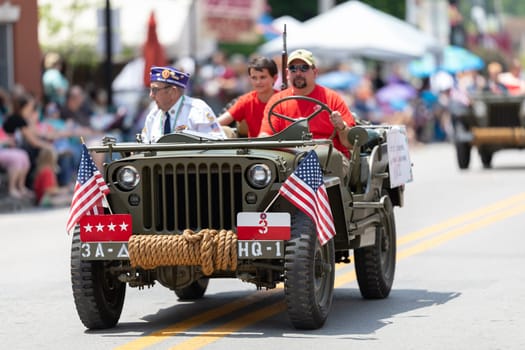 Buckhannon, West Virginia, USA - May 18, 2019: Strawberry Festival, Military veterans of the United States being driven on jeeps during the parade