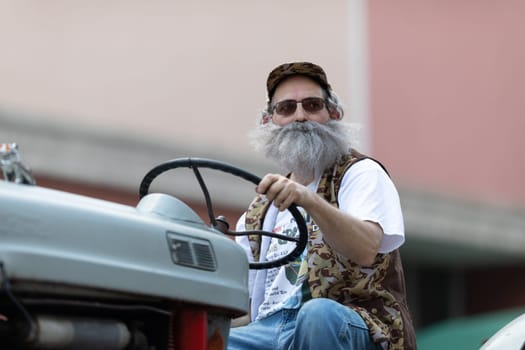 Buckhannon, West Virginia, USA - May 18, 2019: Strawberry Festival, Old Tractors being driven along Main Street during the parade