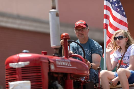 Buckhannon, West Virginia, USA - May 18, 2019: Strawberry Festival, Old Tractors being driven along Main Street during the parade