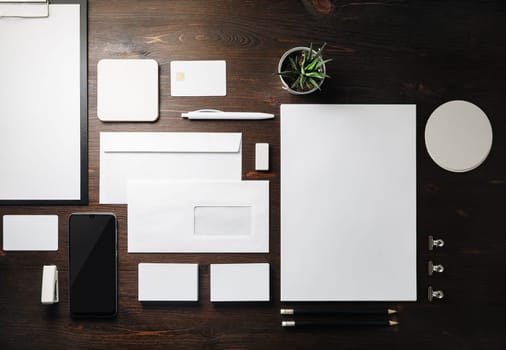 Blank stationery set on wooden background. Template for branding identity. For graphic designers presentations and portfolios. Flat lay.