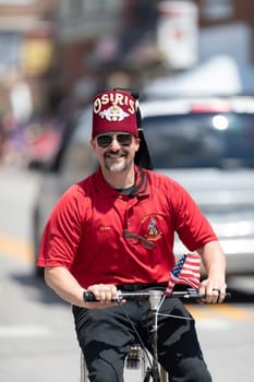Buckhannon, West Virginia, USA - May 18, 2019: Strawberry Festival, Member of the Osiris Temple, riding a mini car during the parade