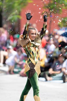 Buckhannon, West Virginia, USA - May 18, 2019: Strawberry Festival, Women dress up as Jesters, wearing medieval outfits, dancing during the parade