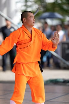 Columbus, Ohio, USA - May 26, 2019: Columbus Asian Festival, Chinese Men and women performing a display of shaolin martial arts in the amphitheater at Franklin Park