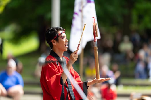 Columbus, Ohio, USA - May 26, 2019: Columbus Asian Festival, Members of Takarabune dance group from Japan, wearing traditional clothing performing traditional dances at the Amphitheater in the Franklin Park.