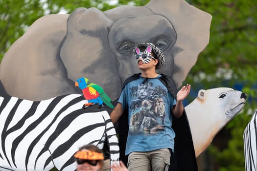 Louisville, Kentucky, USA - May 2, 2019: The Pegasus Parade, People holding signs promoting nature conservation during the parade