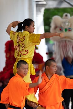 Columbus, Ohio, USA - May 26, 2019: Columbus Asian Festival, Chinese Men and women performing a display of shaolin martial arts in the amphitheater at Franklin Park