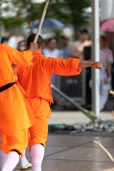 Columbus, Ohio, USA - May 26, 2019: Columbus Asian Festival, Chinese Men and women performing a display of shaolin martial arts in the amphitheater at Franklin Park