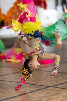 Columbus, Ohio, USA - May 26, 2019: Columbus Asian Festival, Young girls performing Hmong traditional dances, in the amphitheater at Franklin Park