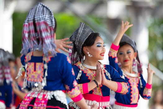 Columbus, Ohio, USA - May 26, 2019: Columbus Asian Festival, Young girls performing Hmong traditional dances, in the amphitheater at Franklin Park