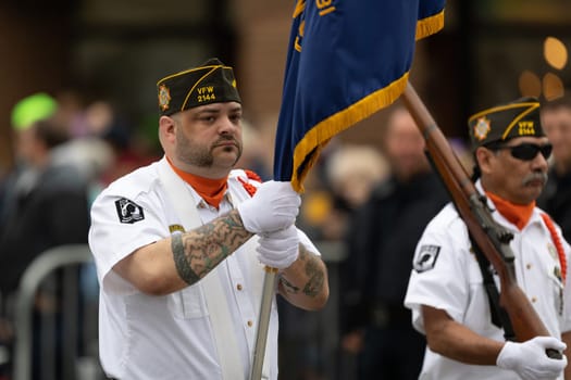 Holland, Michigan, USA - May 11, 2019: Tulip Time Parade, Members of Veterans of Foreign Wars, marching down the street during the parade