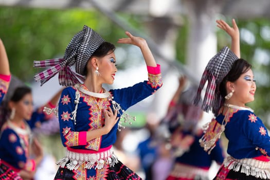 Columbus, Ohio, USA - May 26, 2019: Columbus Asian Festival, Young girls performing Hmong traditional dances, in the amphitheater at Franklin Park