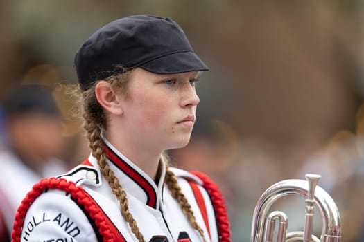 Holland, Michigan, USA - May 11, 2019: Tulip Time Parade, Members of the Holland High School Marching Dutchman Band, performing during the parade