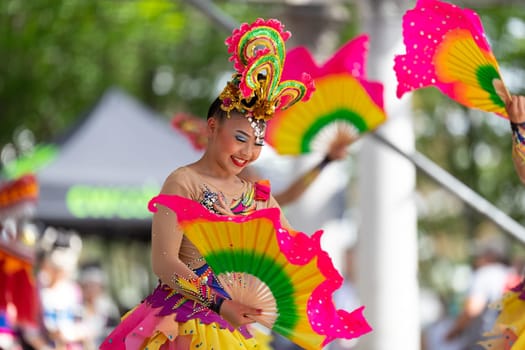 Columbus, Ohio, USA - May 26, 2019: Columbus Asian Festival, Young girls performing Hmong traditional dances, in the amphitheater at Franklin Park