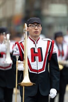 Holland, Michigan, USA - May 11, 2019: Tulip Time Parade, Members of the Holland High School Marching Dutchman Band, performing during the parade