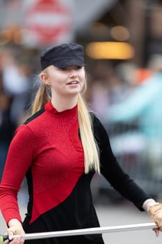 Holland, Michigan, USA - May 11, 2019: Tulip Time Parade, Members of the Holland High School Marching Dutchman Band, performing during the parade