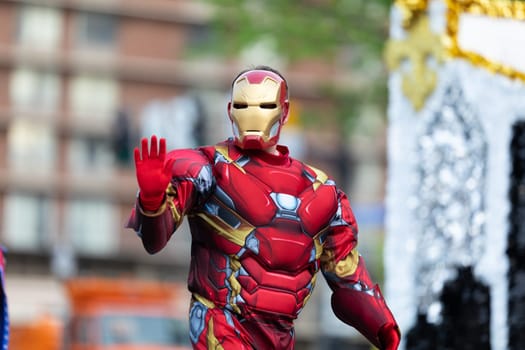 Louisville, Kentucky, USA - May 2, 2019: The Pegasus Parade, People with a float, dress up as superhero chatacters during the parade