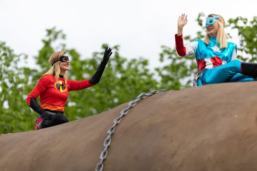 Louisville, Kentucky, USA - May 2, 2019: The Pegasus Parade, Women dress up as superheroes, riding on top of a giant potato during the parade
