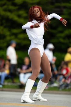 Louisville, Kentucky, USA - May 2, 2019: The Pegasus Parade, women Members of the Dazzling Cardettes, performing dancing during the parade