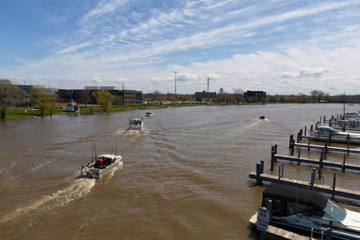 St. Joseph, Michigan, USA - May 4, 2019: Small boat yard on Marina Island with fishing boats arriving