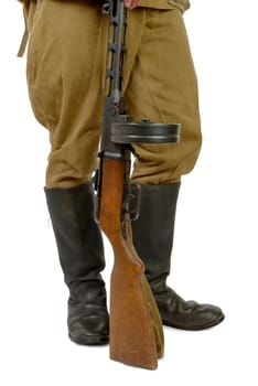 Soviet machine gun at the foot of a soldier on the white background