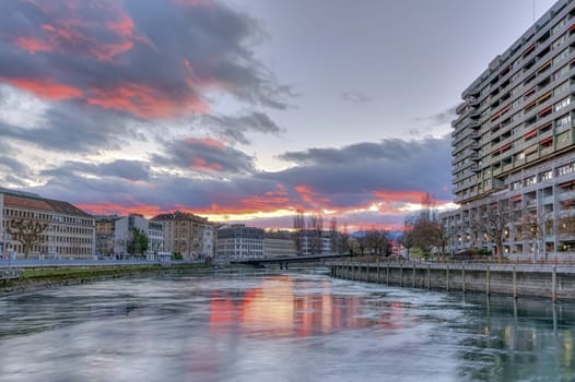 Rhone river, Sous-Terre bridge and buildings by sunset, Geneva, Switzerland, HDR