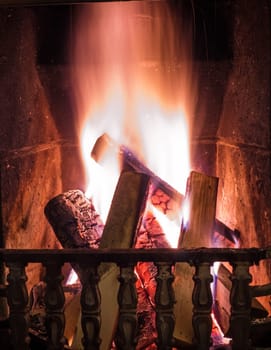 Burning fire in the fireplace. Cosy place