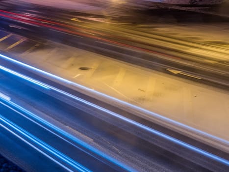 Car light in night on ice road in snow winter, Latvia