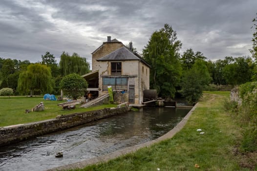 Old water mill on the tuna river running through the city of Virton eprovince du Luxembourg in Belgium