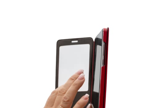 The fingers of a female hand operate the touchscreen of a mobile phone isolated on a white background. Macro of Smartphone with red cover.